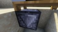 The observer facing upwards towards the bed (Image via Minecraft)